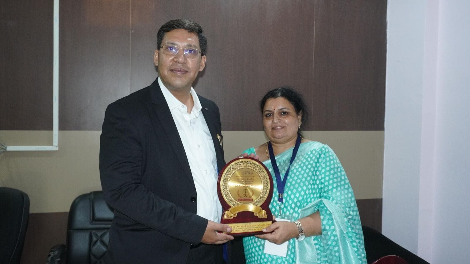 Akshat Chaudhary receiving a memento