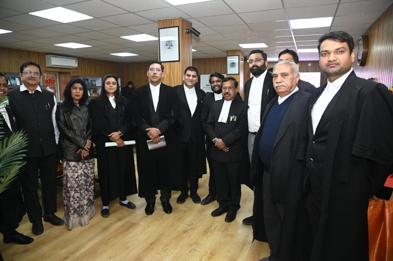 A group of advocates in gowns standing together